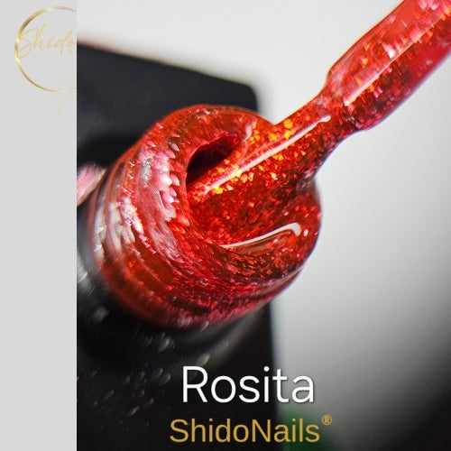 ShidoNails Rosita glitter gellak close-up die de levendige, oranje-rode glitterstructuur toont op het kwastje en in de opening van het flesje.