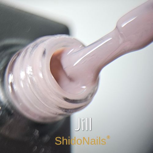 Close-up van de ShidoNails gellak flesopening en het penseel in de kleur Jill, een zachte nude tint.