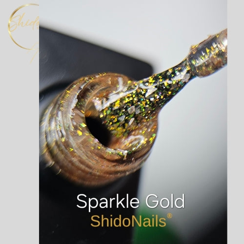 Luxe gouden glitters van ShidoNails Sparkle Gold gellak op een applicatiekwastje voor professionele nagels.